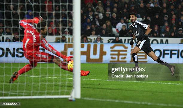 Riyad Mahrez of Leicester City scores his team's third and hat trick goal during the Barclays Premier League match between Swansea City and Leicester...