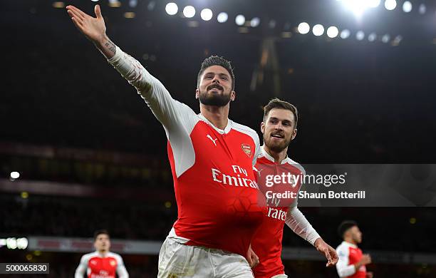 Olivier Giroud of Arsenal celebrates scoring his team's second goal with his team mate Aaron Ramsey during the Barclays Premier League match between...