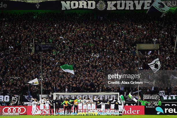 Players of Moenchengladbach celebrate with the fans after the Bundesliga match between Borussia Moenchengladbach and FC Bayern Muenchen at...