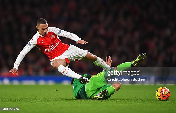 Kieran Gibbs of Arsenal is tackled by Sebastian Coates of Sunderland during the Barclays Premier League match between Arsenal and Sunderland at...