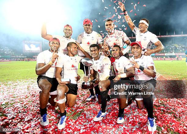 The Fiji team celebrate beating England to win the Cup Final during the Emirates Dubai Rugby Sevens - HSBC World Rugby Sevens Series at The Sevens...