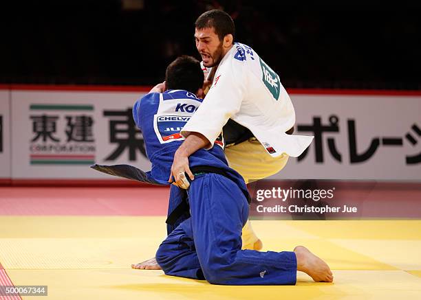 Avtandili Tchrikishvili of Georgia and Lee Seungsu of South Korea compete in the Men's 81kg final at Tokyo Metropolitan Gymnasium on December 5, 2015...