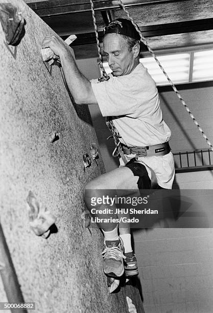 Michael Rubens Bloomberg, candid shot, Bloomberg has climbed to the top of a climbing wall, Side view, ca 47 years of age, 1997. .