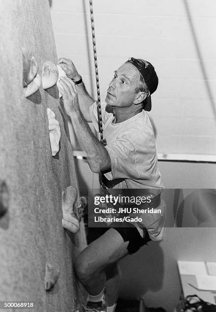 Michael Rubens Bloomberg, Candid shot, Bloomberg is climbing an indoor climbing wall, Side view, ca 47 years of age, 1997. .