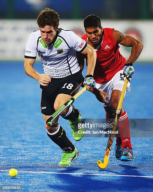 Oliver Korn of Germany vies with Devohn Noronha Teixeira of Canada during the match between Germany and Canada on day nine of The Hero Hockey League...