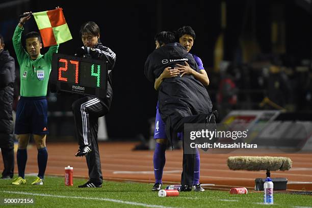 Hajime Moriyasu, coach of Sanfrecce Hiroshima hugs Hiroki Mizumoto . Sanfrecce Hiroshima won the J.League 2015. During the J.League 2015 Championship...