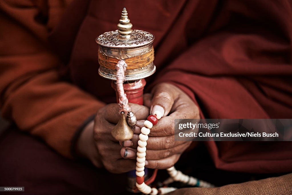 Close up of buddhist monks hands holding prayer beads, Thamel, Kathmandu, Nepal