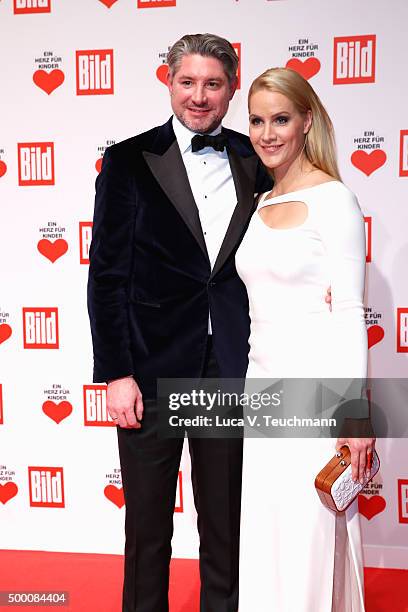 Andreas Pfaff and Judith Rakers arrive for the Ein Herz Fuer Kinder Gala 2015 at Tempelhof Airport on December 5, 2015 in Berlin, Germany.