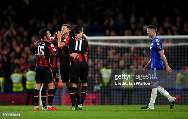 Bournemouth players Adam Smith , Junior Stanislas , Dan Gosling and Charlie Daniels celebrate their 1-0 win while Gary Cahill of Chelsea leaves the...