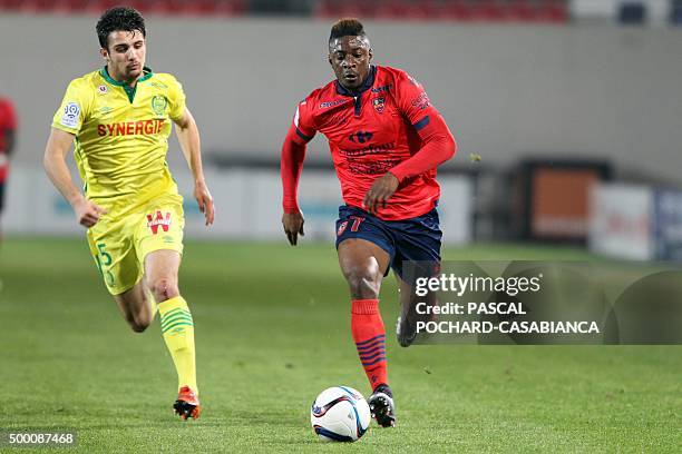 Ajaccio's French forward Kevin Mayi vies with Nantes' French defender Leo Dubois during the French L1 football match Gazelec Ajaccio against Nantes...