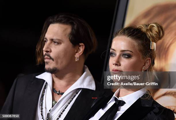 Actors Johnny Depp and Amber Heard arrive at the premiere of Focus Features' 'The Danish Girl' at Westwood Village Theatre on November 21, 2015 in...
