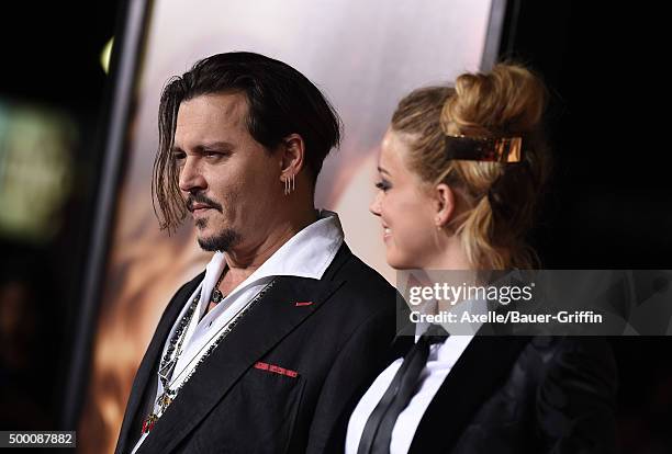 Actors Johnny Depp and Amber Heard arrive at the premiere of Focus Features' 'The Danish Girl' at Westwood Village Theatre on November 21, 2015 in...