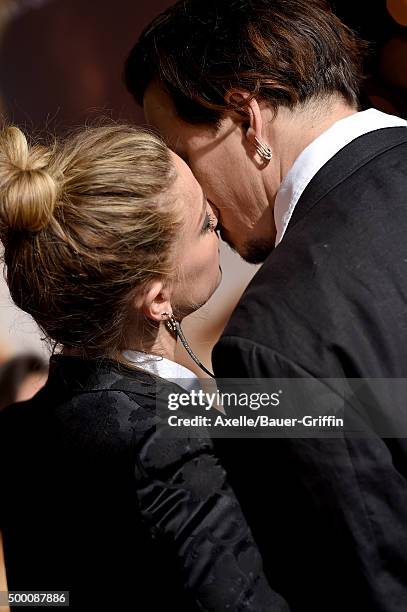 Actors Johnny Depp and Amber Heard arrive at the premiere of Focus Features' 'The Danish Girl' at Westwood Village Theatre on November 21, 2015 in...
