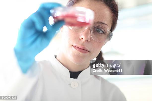 young female scientist at work in lab - lab closeups stock-fotos und bilder