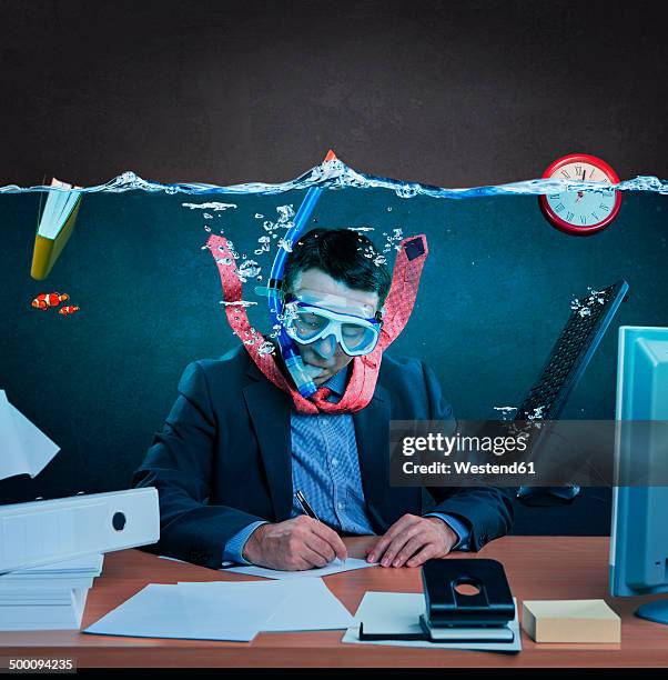 office worker with snorkel, working under water - drowning stock-fotos und bilder