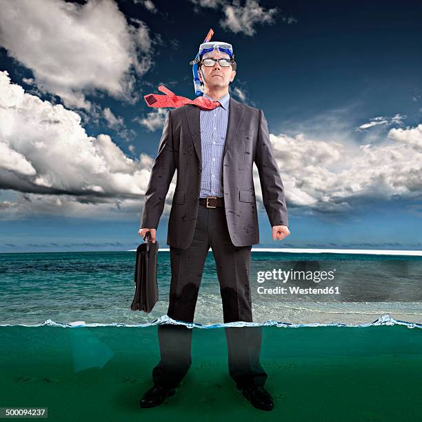 businessman standing ankle-deep in water, wearing snorkel - ankle deep in water stock illustrations