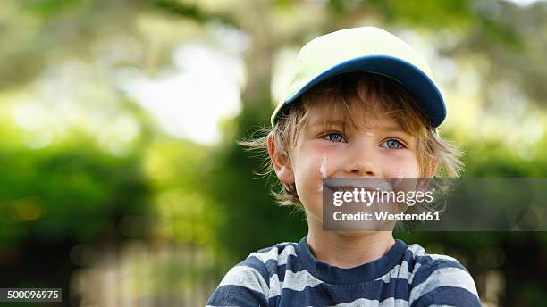 portrait of smiling little boy with milk moustache - solo bambini maschi foto e immagini stock