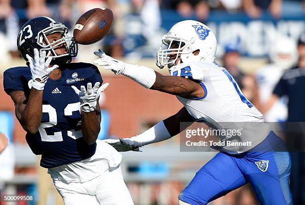 Wide receiver Derek Keaton of the Georgia Southern Eagles can't hold onto the ball as he's covered by cornerback Jerome Smith of the Georgia State...