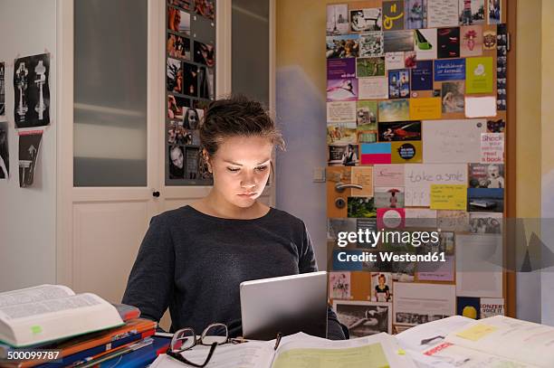 female pupil doing homework with digital tablet - open day 14 stock pictures, royalty-free photos & images