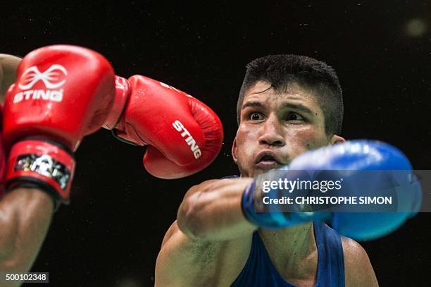 Brazilian Juliao De Miranda Henriques Neto fights against Marocan Achraf Kharroubi during the men's Fly test event for Rio 2016 Olympic Games, in Rio...