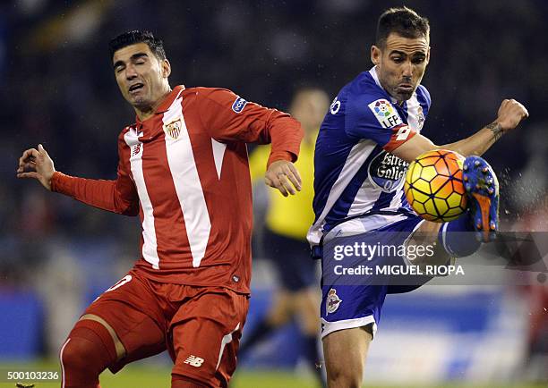 Sevilla's Spanish forward Jose Antonio Reyes vies with Deportivo La Coruna's defender Fernando Navarro during the Spanish league football match RC...