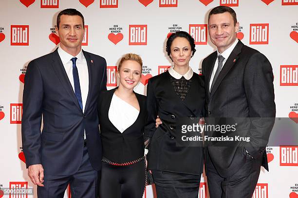 Wladimir Klitschko, Hayden Panettiere, Natalia Klitschko and Vitali Klitschko attend the Ein Herz Fuer Kinder Gala 2015 at Tempelhof Airport on...