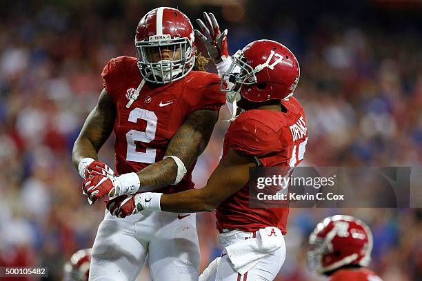 Running back Derrick Henry of the Alabama Crimson Tide celebrates with running back Kenyan Drake of the Alabama Crimson Tides after scoring a second...