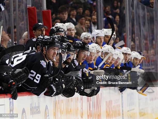 The New York Islanders and the St. Louis Blues watch the shootout at the Barclays Center on December 4, 2015 in Brooklyn borough of New York City.