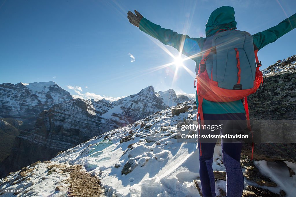 Hiker celebrating on mountain top