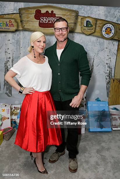 Actress Tori Spelling and husband actor Dean McDermott attend 2015 Santa's Secret Workshop Benefiting L.A. Family Housing at Andaz Hotel on December...