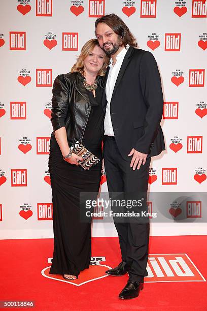 Ulrike Zeitlinger and her husband Gregor Haake attend the Ein Herz Fuer Kinder Gala 2015 at Tempelhof Airport on December 5, 2015 in Berlin, Germany.