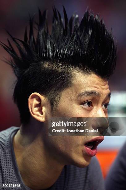 Jeremy Lin of the Charlotte Hornets watches from the bench as his teammates take on the Chicago Bulls at the United Center on December 5, 2015 in...