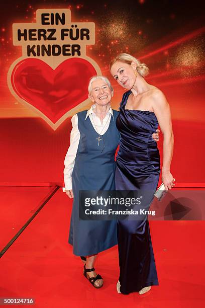 Karoline Mayer and Bettina Wulff attend the Ein Herz Fuer Kinder Gala 2015 show at Tempelhof Airport on December 5, 2015 in Berlin, Germany.