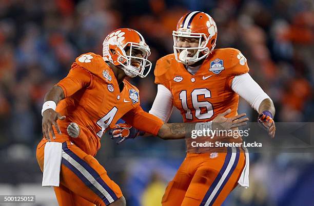 Deshaun Watson and teammate Jordan Leggett of the Clemson Tigers react after Watson threw a touchdown in the first half against the North Carolina...