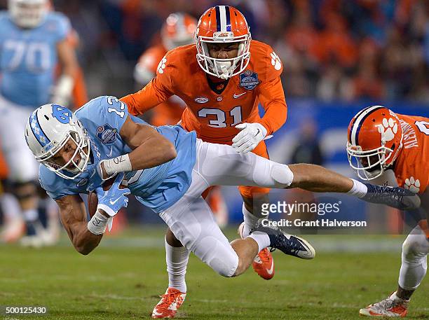 Mack Hollins of the North Carolina Tar Heels makes a catch against Ryan Carter of the Clemson Tigers during the Atlantic Coast Conference Football...