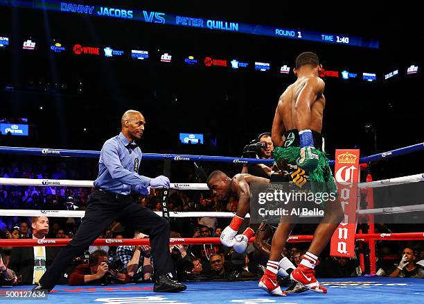 Danny Jacobs defeats Peter Quillin by TKO during their WBA Middleweight Championship bout on December 5, 2015 in the Brooklyn borough of New York...