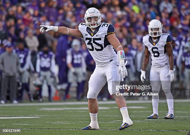 Linebacker Nick Kwaitkoski of the West Virginia Mountaineers points out instructions against the Kansas State Wildcats during the first half on...
