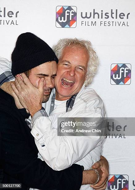 Executive Vice President of Cineplex Filmed Entertainment Michael Kennedy embraces Actor Rossif Sutherland on the red carpet before the Borsos...