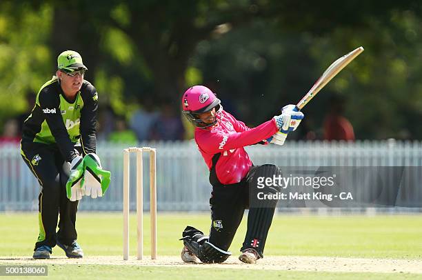 Lisa Sthalekar of the Sixers bats as Claire Koski of the Thunder keeps wicket during the Women's Big Bash League match between the Sydney Thunder and...