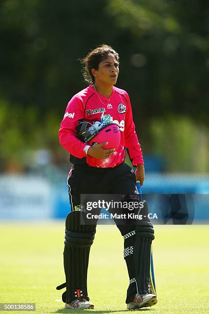 Lisa Sthalekar of the Sixers walks from the field after being dismissed during the Women's Big Bash League match between the Sydney Thunder and the...