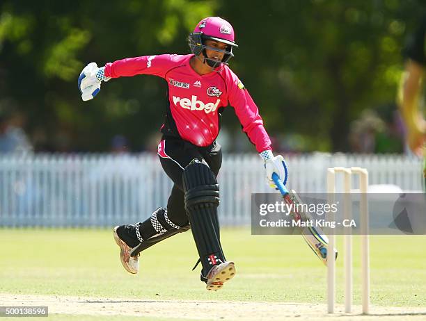 Lisa Sthalekar of the Sixers slides in to avoid a runout during the Women's Big Bash League match between the Sydney Thunder and the Sydney Sixers at...