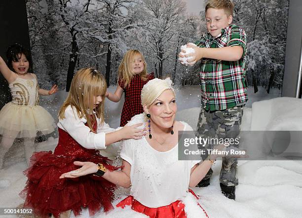 Simone Lynn, Stella McDermot, Hattie McDermot, Actress Tori Spelling and Liam McDermottattends 2015 Santa's Secret Workshop Benefiting L.A. Family...