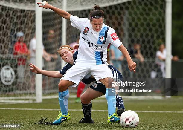 Lisa De Vanna of City and Annabel Martin of the Victory compete for the ball during the round eight W-League match between the Melbourne Victory and...