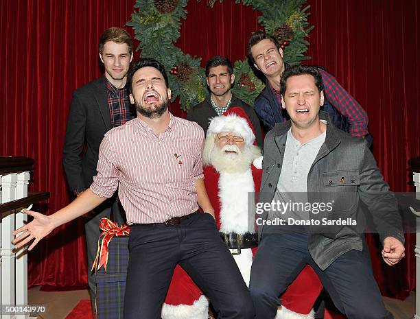 Actors Cameron Fuller, David Bernon and Jack Quaid, Actors Jack Falahee and Matt McGorry pose with Santa Claus at the Brooks Brothers holiday party...