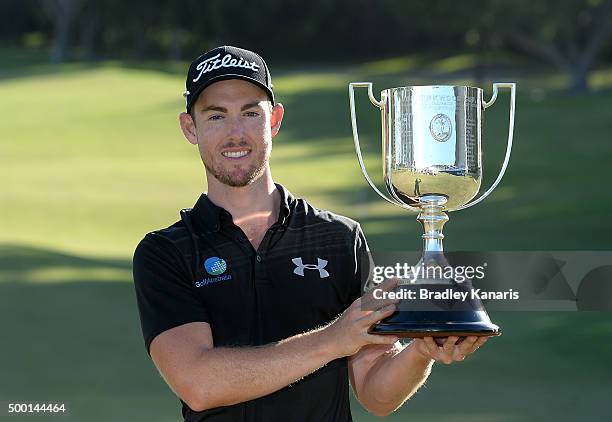 Nathan Holman of Australia celebrates victory as he holds up the Kirkwood Cup during the 2015 Australian PGA Championship at Royal Pines Resort on...