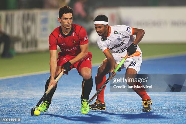 Tanguy Cosyns of Belgiumn vies with Birendra Lakra of India during the match between India and Belgium on day nine of The Hero Hockey League World...