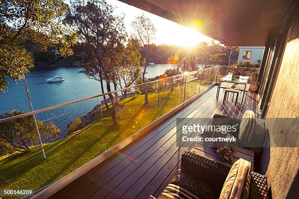 waterfront house balcony - deck stock pictures, royalty-free photos & images