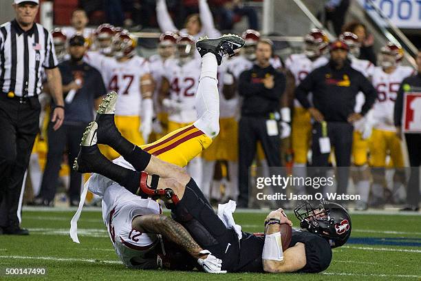 Quarterback Kevin Hogan of the Stanford Cardinal is sacked by linebacker Su'a Cravens of the USC Trojans during the first quarter of the Pac-12...