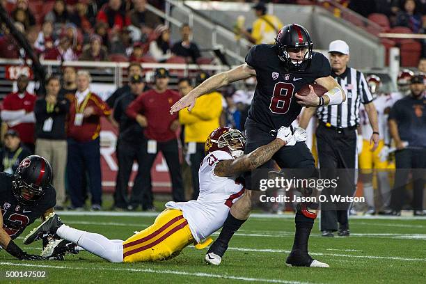 Quarterback Kevin Hogan of the Stanford Cardinal is sacked by linebacker Su'a Cravens of the USC Trojans during the first quarter of the Pac-12...