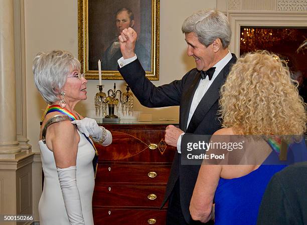 United States Secretary of State John F. Kerry, center, and singer Rita Moreno, left, one of the five recipients of the 38th Annual Kennedy Center...